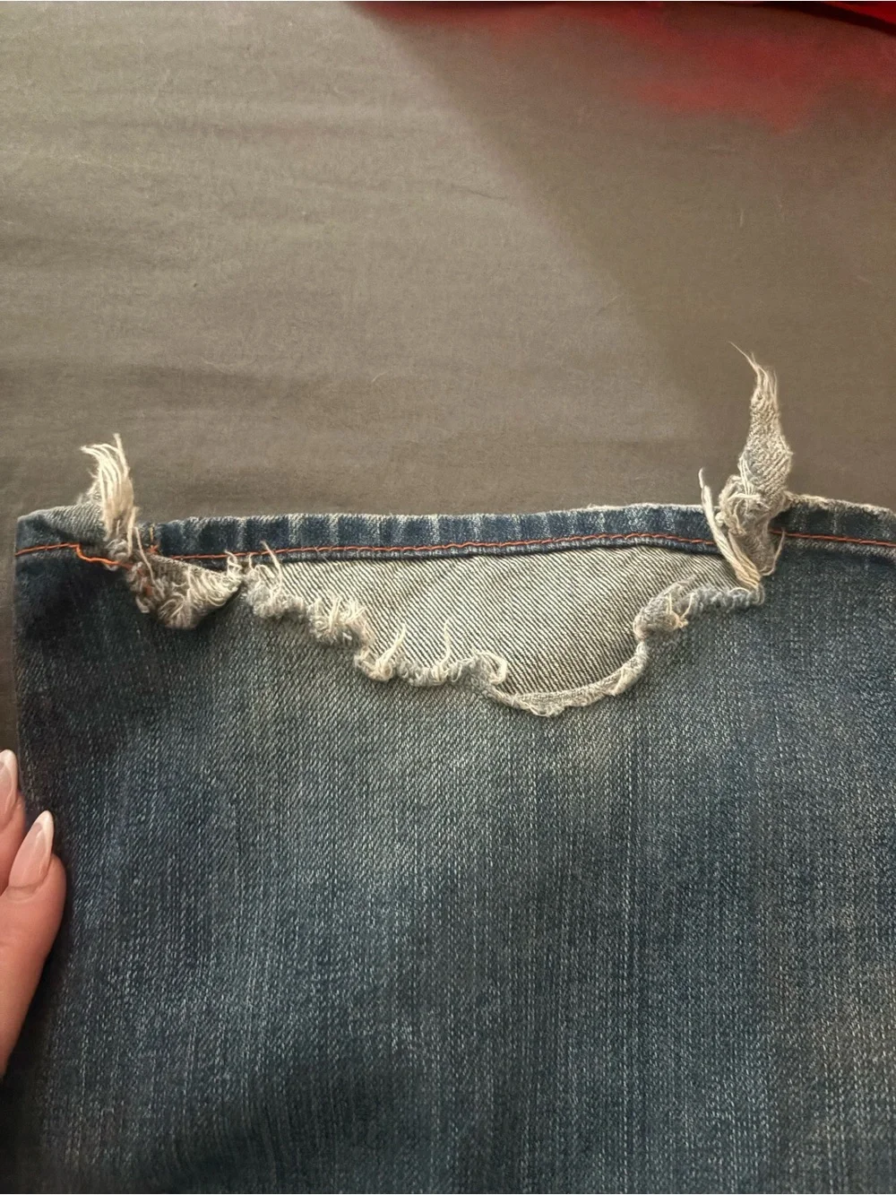 True Religion Men's Straight Jeans in Medium Blue with Distressed Hem